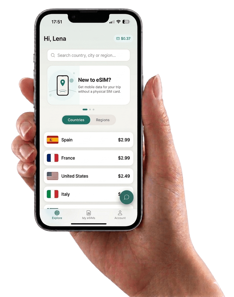 Hand holding a phone showing the Vyroam app